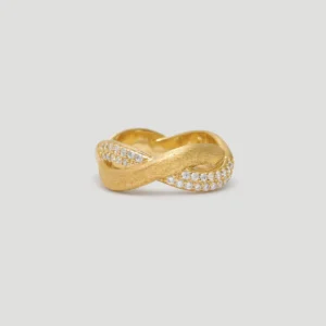 This image showcases Lazesoul Jewelry's "Entwined Dimensions" Intertwined Ring. The ring is made of S925 sterling silver and plated with 18K gold. Its unique design features intertwined surfaces, which from the front view, form an elegant infinity symbol (∞) pattern. Parts of the ring's surface have a matte texture, while other parts are smooth, and the neatly arranged 5A zirconia stones sparkle brilliantly.