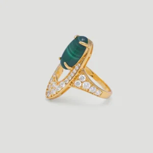 The image features an exquisite Gold Malachite Ring, crafted from S925 sterling silver plated with 18K gold. The centerpiece of this stunning piece is an oval-shaped natural malachite stone, securely held by four prongs. Surrounding the malachite are numerous sparkling 5A cubic zirconia stones, enhancing the ring's brilliance and elegance. The ring is displayed from a side view, showcasing its intricate design and craftsmanship.