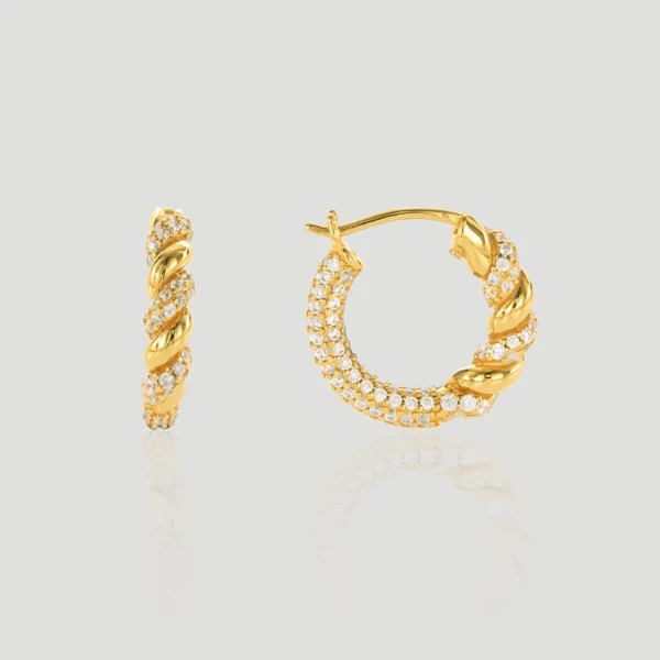 The image shows a pair of Vine Hoop Gold Vermeil Intertwined Hoop Earrings. These hoop earrings are crafted from S925 sterling silver and are plated with gold vermeil. The design features an elegant intertwined pattern, combining smooth, polished gold strands with strands encrusted with small, sparkling diamonds. One earring is displayed in a side view, while the other is shown in a front view, highlighting the intricate details and craftsmanship of the intertwined design. The earrings are positioned against a plain, light grey background, emphasizing their luxurious appearance and sophisticated style.