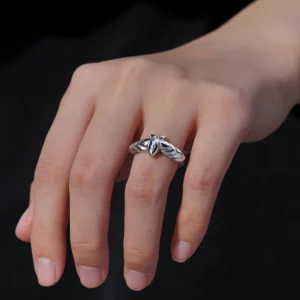 The Mirror Lotus Ring from Lazesoul Handmade Anime Jewelry is a 999 pure silver adjustable ring, inspired by Frieren: Beyond Journey’s End. The image captures the ring elegantly worn on a hand, showcasing its intricate lotus flower and leaf details. The polished silver finish reflects light beautifully, enhancing its premium craftsmanship. The adjustable open-band design ensures a perfect fit, making it ideal for anime collectors and jewelry lovers. Set against a dark background, the luminous silver ring stands out, emphasizing its artistic elegance. A timeless accessory for daily wear or special occasions.