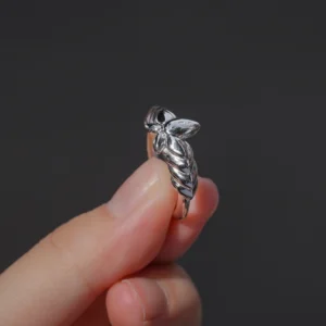 A close-up view of the Lazesoul Handmade Mirror Lotus Ring reveals its exquisite detail—crafted from 999 pure silver with a bold, sculptural lotus design inspired by Frieren: Beyond Journey’s End. The open adjustable band and anime-style motif make it a perfect accessory for fans of fantasy, artful jewelry, and storytelling through design.
