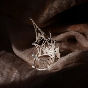 Close-up view of the inner wall of our Butterfly Ring in 925 Sterling Silver | Art Fantasy Pinky Ring. The image highlights intricate engravings featuring delicate butterfly motifs intertwined with subtle web-like patterns, showcasing exceptional artisanal craftsmanship. This hidden detail adds an exclusive touch to a unique accessory, making it ideal for trendsetters seeking modern elegance with a fantasy-inspired twist.