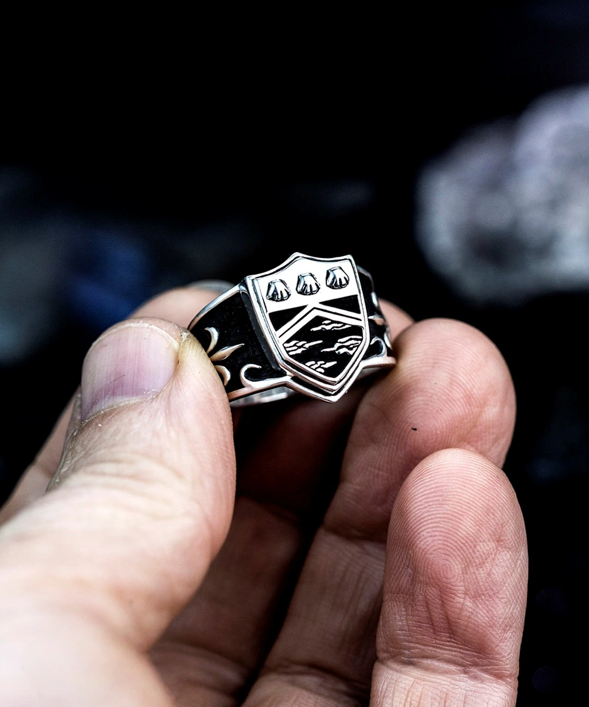 A close-up of a hand holding the Katekyo Hitman Reborn Vongola Ring in 925 Sterling Silver, a standout piece in men rings silver, showcasing its polished finish and anime-inspired emblem.