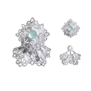 A pair of snowflake earrings, crafted in 925 sterling silver, featuring an intricate lace-like design. Adorned with shimmering Mint Green gemstones, the earrings capture the icy brilliance of winter’s beauty. The image also showcases the earrings' detachable components, highlighting their versatile styling options.