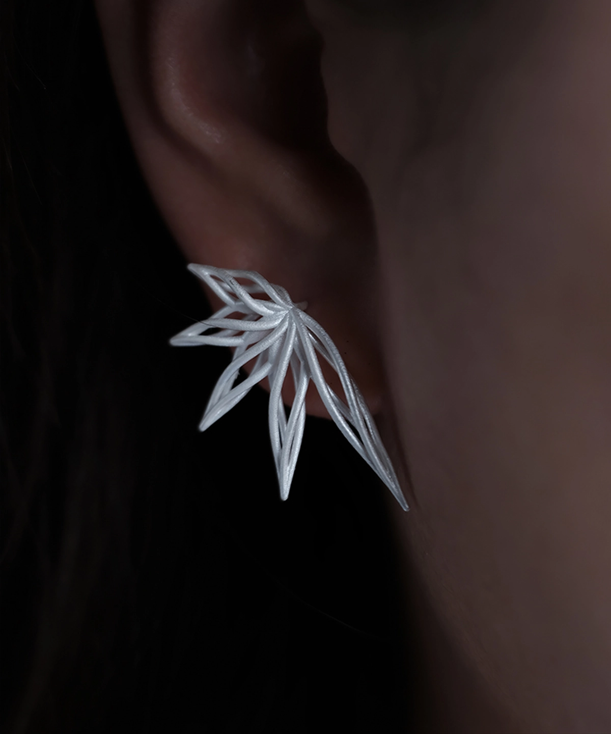 Close-up of Dancing Petals-Organic Sterling Silver Statement Earrings, featuring an elegant leaf-inspired design with fluid, organic curves in polished S925 sterling silver.