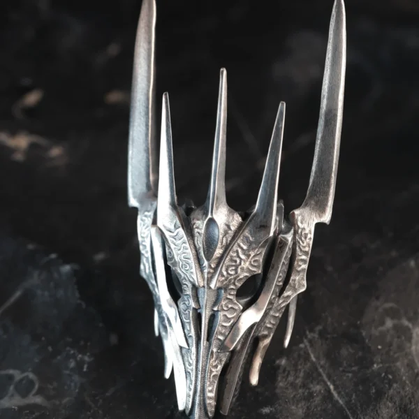 Dark Lord Ring for Men-925 Sterling Silver Armor Ring 06 Close-up image of the Dark Lord Ring for Men, a handcrafted 925 sterling silver Gothic Armor Ring with an oxidized finish. Designed with intricate engravings and bold, spiked details, this ring embodies dark elegance and power. Inspired by Sauron from The Lord of the Rings, it features a dramatic armor-like structure that enhances its commanding presence.