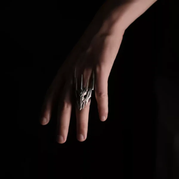 Dark Lord Ring for Men-925 Sterling Silver Gothic Armor Ring 09 A hand wearing the Dark Lord Ring for Men, a 925 Sterling Silver Gothic Armor Ring inspired by Sauron from The Lord of the Rings. The ring features intricate, spiked designs resembling armor.