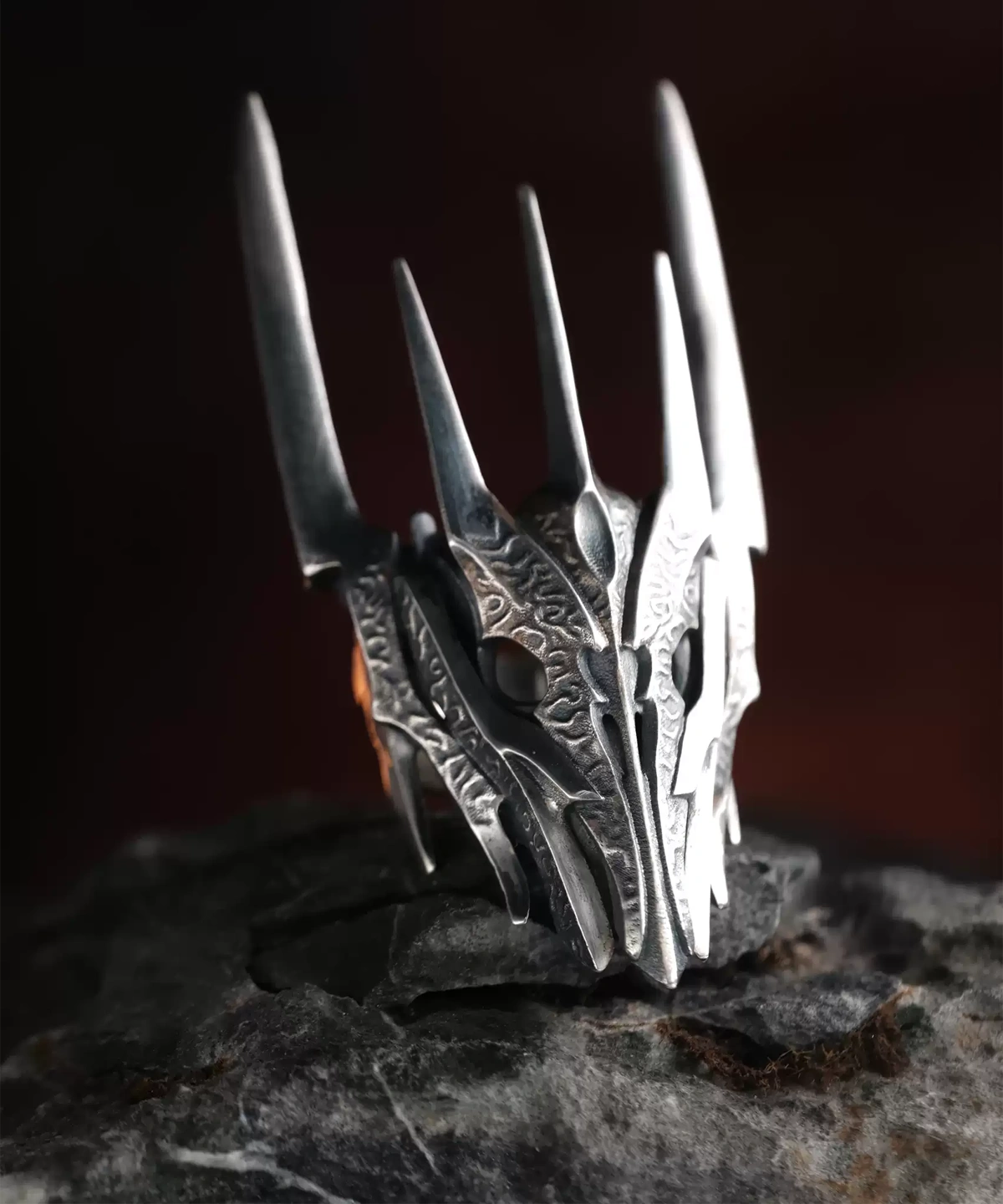 Close-up image of the Dark Lord Ring for Men, a handcrafted 925 sterling silver Gothic Armor Ring with an oxidized finish. Designed with intricate engravings and bold, spiked details, this ring embodies dark elegance and power. Inspired by Sauron from The Lord of the Rings, it features a dramatic armor-like structure that enhances its commanding presence.