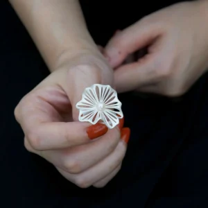 A delicate 925 silver adjustable leaf ring with a freshwater pearl, designed with intricate leaf details. The elegant handcrafted Adjustable Leaf Ring from Lazesoul Handmade Natural Jewelry is photographed on a hand, showcasing its timeless beauty.
