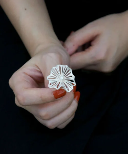 A delicate 925 silver adjustable leaf ring with a freshwater pearl, designed with intricate leaf details. The elegant handcrafted Adjustable Leaf Ring from Lazesoul Handmade Natural Jewelry is photographed on a hand, showcasing its timeless beauty.