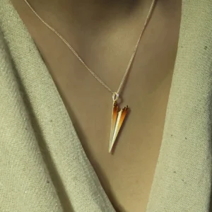 A close-up of a Paper Airplane Necklace crafted in S925 Sterling Silver, featuring a delicate, minimalist design that mimics the iconic shape of a folded paper airplane. The pendant hangs gracefully from an adjustable chain, reflecting light beautifully, making it a stylish and meaningful accessory for everyday wear.