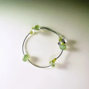 Sterling silver bracelet featuring natural prehnite and peridot gemstones in a handmade, minimalist design. The Prelude Summer bracelet by Lazesoul adds a fresh, elegant touch for summer. A stylish peridot bracelet for natural jewelry lovers.