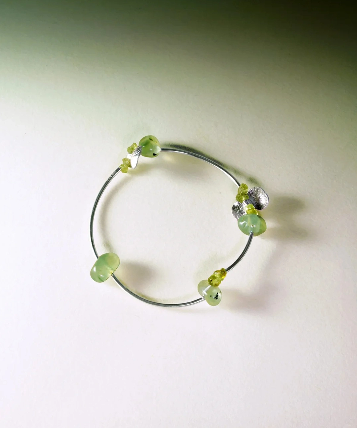 Sterling silver bracelet featuring natural prehnite and peridot gemstones in a handmade, minimalist design. The Prelude Summer bracelet by Lazesoul adds a fresh, elegant touch for summer. A stylish peridot bracelet for natural jewelry lovers.