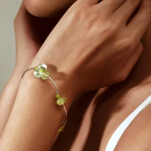 Close-up of a woman wearing the Prelude Summer Peridot Bracelet by Lazesoul, handcrafted from S925 sterling silver with natural prehnite and peridot stones. A delicate, nature-inspired design perfect for summer elegance.