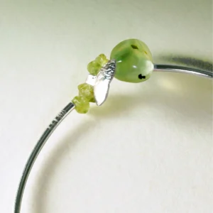 Close-up of handcrafted Peridot Bracelet by Lazesoul, highlighting natural prehnite and vivid peridot stones set in S925 sterling silver; detailed view of the summer-inspired design.