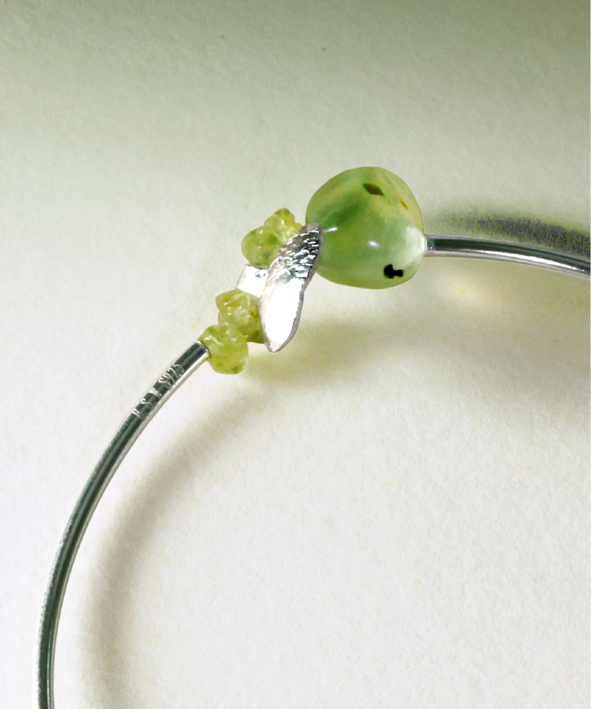 Close-up of handcrafted Peridot Bracelet by Lazesoul, highlighting natural prehnite and vivid peridot stones set in S925 sterling silver; detailed view of the summer-inspired design.