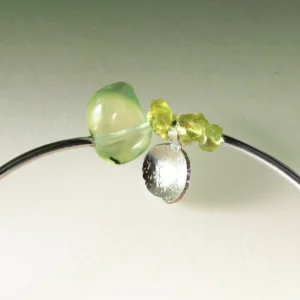 Close-up of handcrafted Peridot Bracelet by Lazesoul, highlighting natural prehnite and vivid peridot stones set in S925 sterling silver; detailed view of the summer-inspired design.