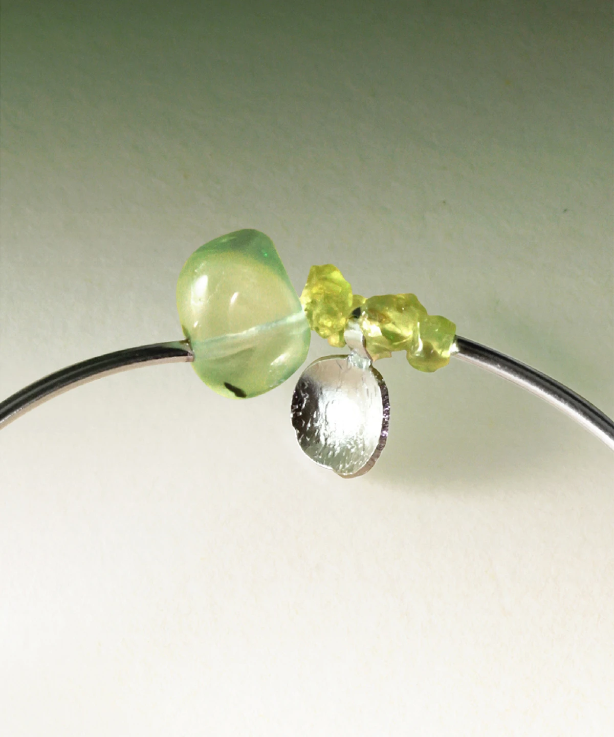 Close-up of handcrafted Peridot Bracelet by Lazesoul, highlighting natural prehnite and vivid peridot stones set in S925 sterling silver; detailed view of the summer-inspired design.