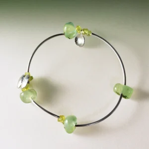 Sterling silver bracelet featuring natural prehnite and peridot gemstones in a handmade, minimalist design. The Prelude Summer bracelet by Lazesoul adds a fresh, elegant touch for summer. A stylish peridot bracelet for natural jewelry lovers.