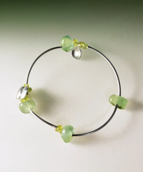 Sterling silver bracelet featuring natural prehnite and peridot gemstones in a handmade, minimalist design. The Prelude Summer bracelet by Lazesoul adds a fresh, elegant touch for summer. A stylish peridot bracelet for natural jewelry lovers.
