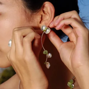 Close-up of a model wearing Lazesoul’s Prelude Summer Peridot Earrings featuring natural prehnite and green peridot stones set in S925 sterling silver; elegant and handcrafted summer jewelry.
