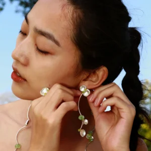 Close-up of a model wearing Lazesoul’s handmade Peridot Earrings and matching necklace from the Prelude Summer collection, crafted with S925 sterling silver, natural Prehnite, and Peridot gemstones.