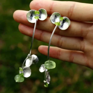 Handmade natural Peridot earrings crafted from S925 sterling silver, featuring elegant silver petals with natural prehnite and peridot gemstones. The Prelude Summer earrings bring nature-inspired beauty and timeless design.