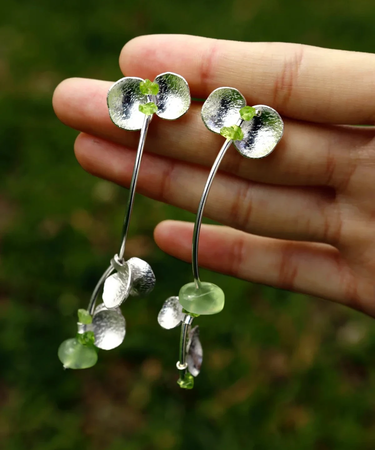 Handmade natural Peridot earrings crafted from S925 sterling silver, featuring elegant silver petals with natural prehnite and peridot gemstones. The Prelude Summer earrings bring nature-inspired beauty and timeless design.