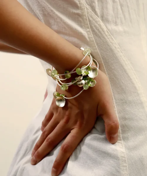 Wrist wearing a Peridot Necklace styled as a bracelet, crafted in S925 sterling silver with natural prehnite and peridot gemstones, highlighting Lazesoul’s handmade natural jewelry elegance.