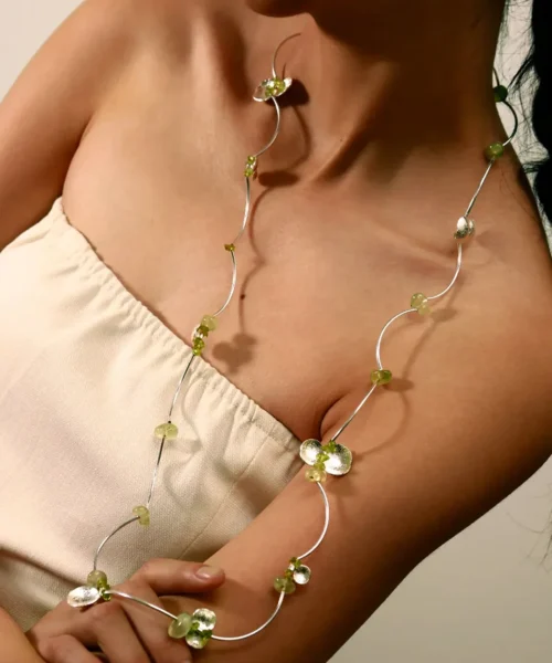 Close-up of a woman wearing the Lazesoul Prelude Summer Necklace, a handmade peridot necklace crafted in S925 sterling silver with natural prehnite gemstones. Elegant, nature-inspired summer jewelry.
