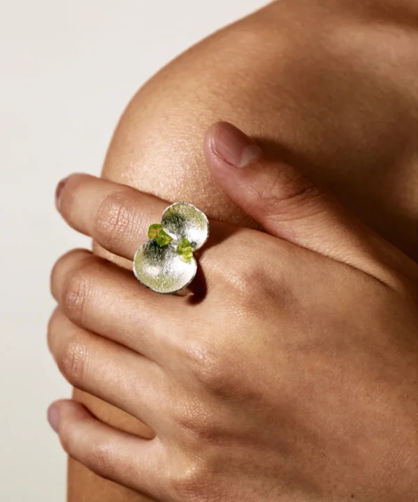 Hand wearing the Lazesoul Prelude Summer Ring featuring natural peridot and prehnite stones set in textured S925 sterling silver, highlighting the elegance of this handcrafted peridot ring design.