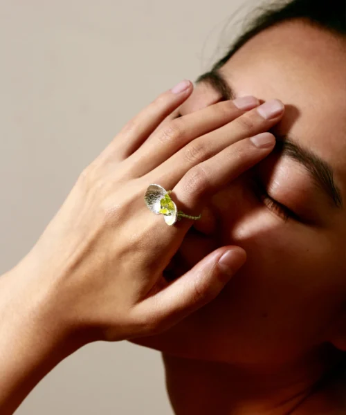 Close-up of Lazesoul’s handmade Prelude Summer Peridot Ring, featuring natural prehnite and peridot gemstones set in S925 sterling silver on a model’s finger, capturing artisanal detail and summer elegance.