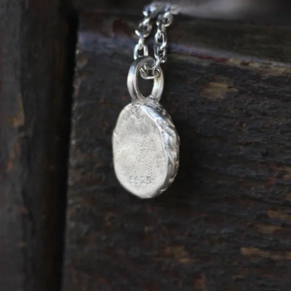 925 Silver Natural Aquamarine Necklace 07 Close-up of the back of the pendant from the Lazesoul Handmade Natural Aquamarine Necklace, crafted in S925 sterling silver, showcasing the 925 hallmark and fine detailing of natural gemstone jewelry.