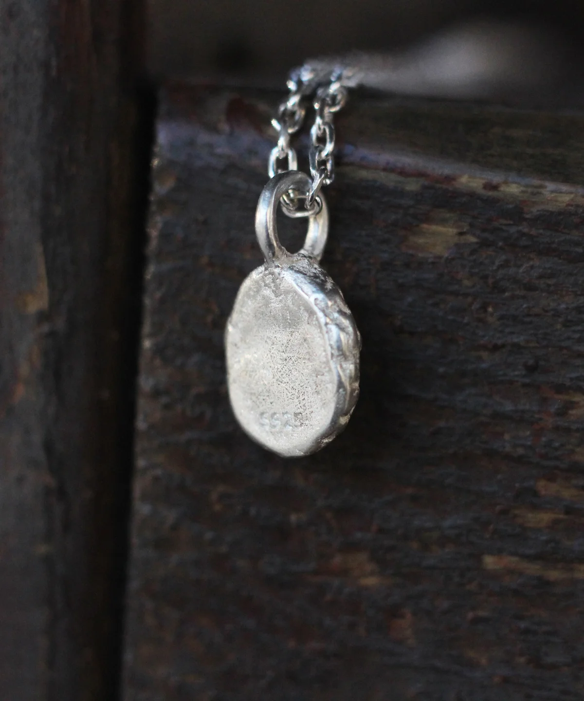 Close-up of the back of the pendant from the Lazesoul Handmade Natural Aquamarine Necklace, crafted in S925 sterling silver, showcasing the 925 hallmark and fine detailing of natural gemstone jewelry.