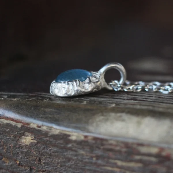 925 Silver Natural Aquamarine Necklace 08 925 Silver Natural Aquamarine Necklace featuring an oval-cut aquamarine gemstone in a handcrafted textured silver setting with a fine sterling silver chain. Handmade gemstone jewelry by Lazesoul.
