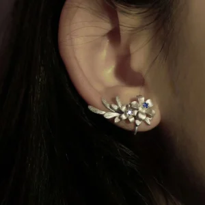 Lily Earrings in S925 sterling silver styled as ear cuffs, featuring elegant floral detailing and shimmering lab-created sapphire stones. Handmade by Lazesoul, highlighting natural beauty and craftsmanship.
