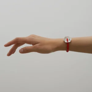 A delicate Little Flower Beaded Bracelet crafted in S925 sterling silver, featuring a red glaze bead in the center of a silver blossom charm. Accented with rich red beaded rings, this handmade design evokes elegance and natural beauty.