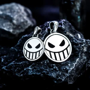 Two S925 silver pirate necklaces feature reversible laugh and cry face spinner pendants, handmade by Lazesoul. Displayed on dark stones, ideal for anime and One Piece fans seeking unique pirate-inspired jewelry.