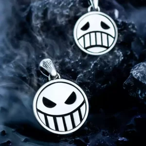 Close-up of S925 Silver Pirate Necklace with a reversible spinner pendant, featuring Laugh & Cry faces. Handmade anime jewelry inspired by One Piece, shown on dark background with black stones for dramatic effect.
