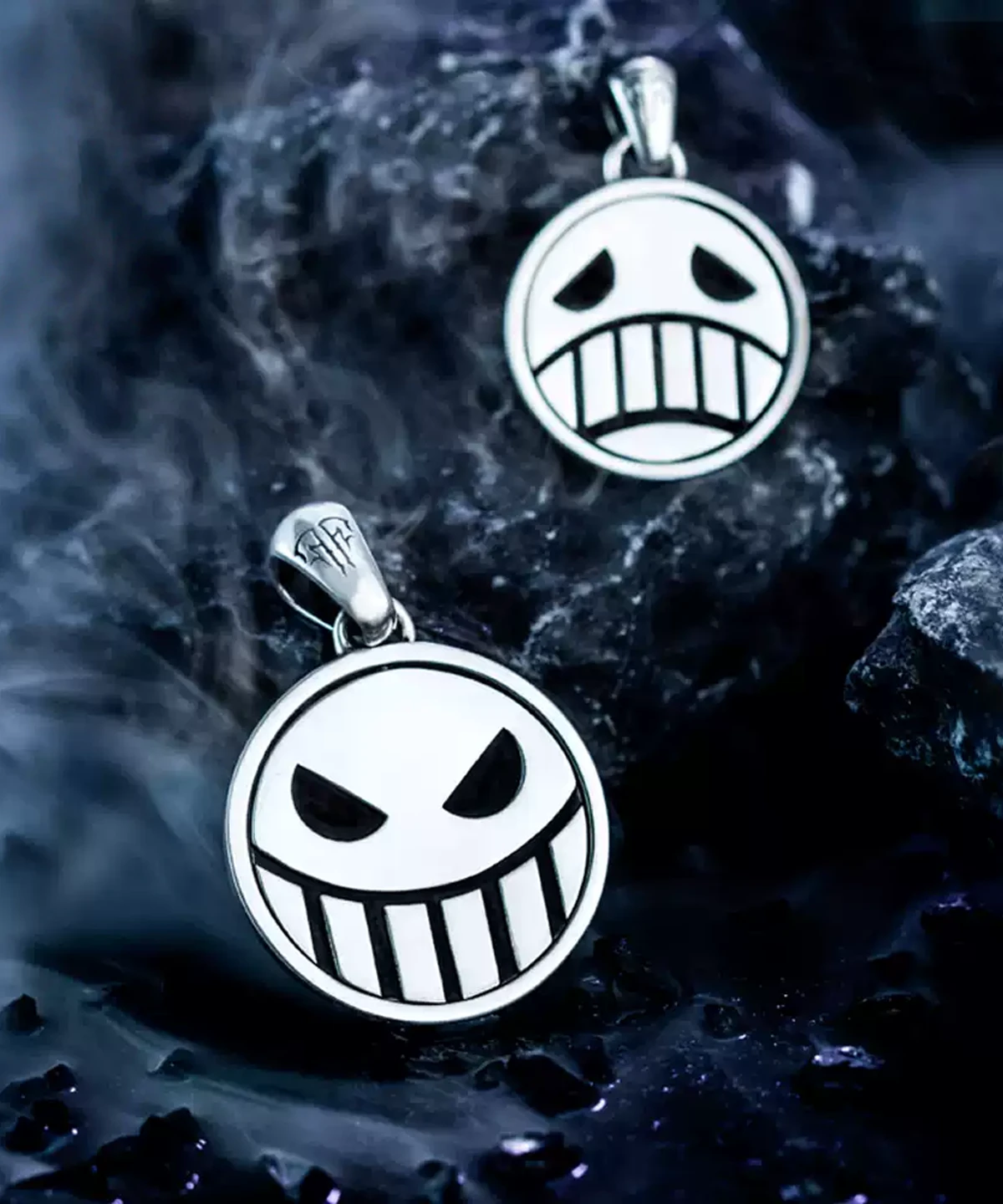 Close-up of S925 Silver Pirate Necklace with a reversible spinner pendant, featuring Laugh & Cry faces. Handmade anime jewelry inspired by One Piece, shown on dark background with black stones for dramatic effect.