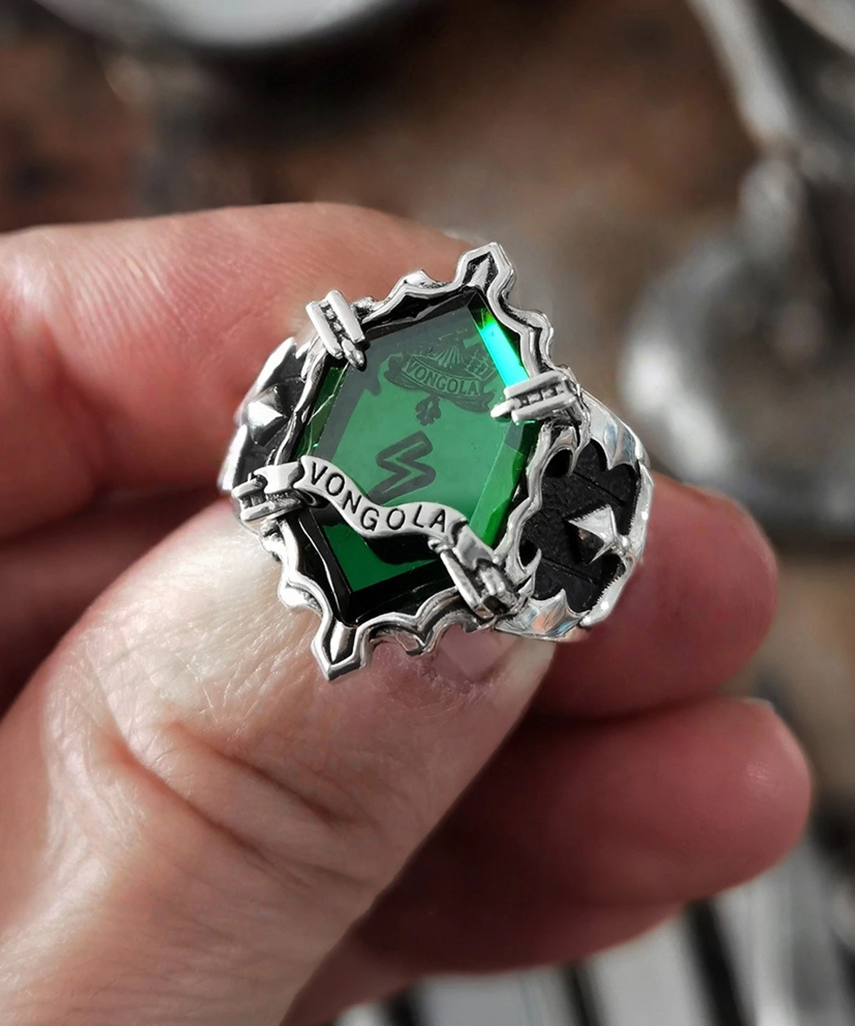 Close-up of Lazesoul’s S925 Sterling Silver Guardian Ring featuring a vivid green gemstone, lightning-inspired details, and a Vongola banner—anime jewelry from Katekyo Hitman Reborn.
