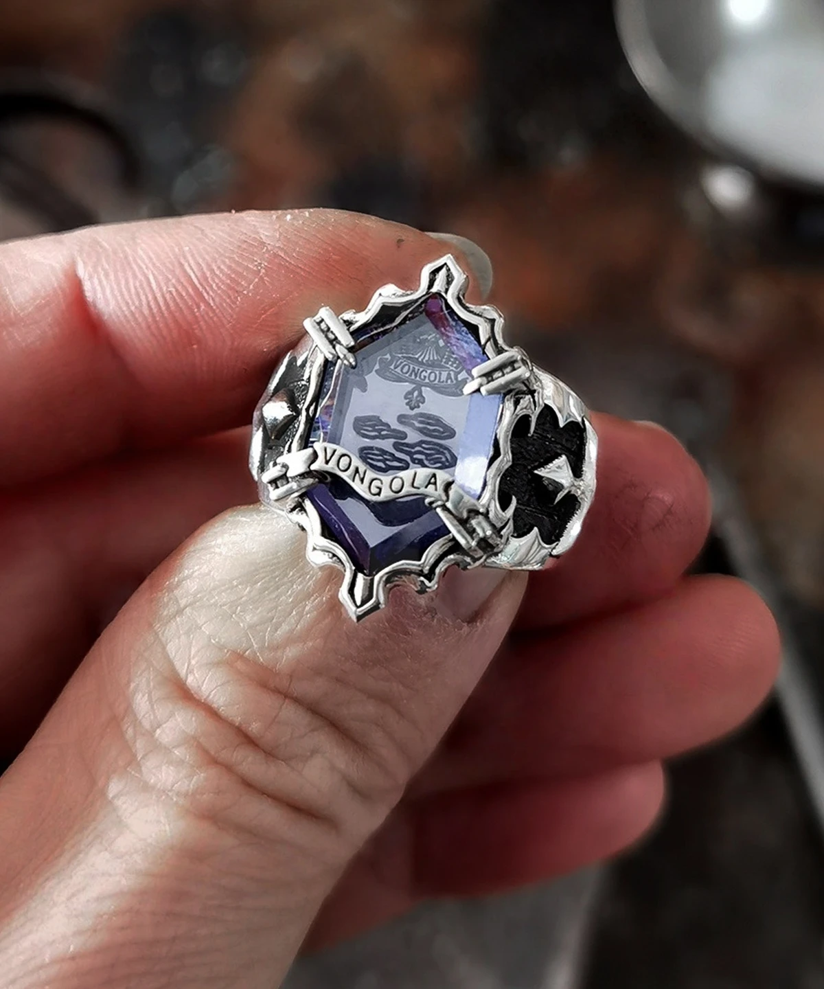 Hand holding the Lazesoul S925 Sterling Silver Guardian Ring-Mist Ring inspired by Katekyo Hitman Reborn; features a vivid purple gemstone engraved with “Vongola.” Elegant anime jewelry for fans and collectors.