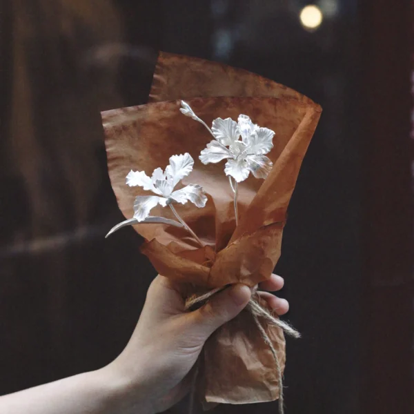 A delicate handmade Iris Bouquet wrapped in rustic brown paper, featuring Lazesoul’s 925 sterling silver artistry. Perfect as timeless Art Gifts, this mini bouquet captures elegance, craftsmanship, and nature-inspired beauty.