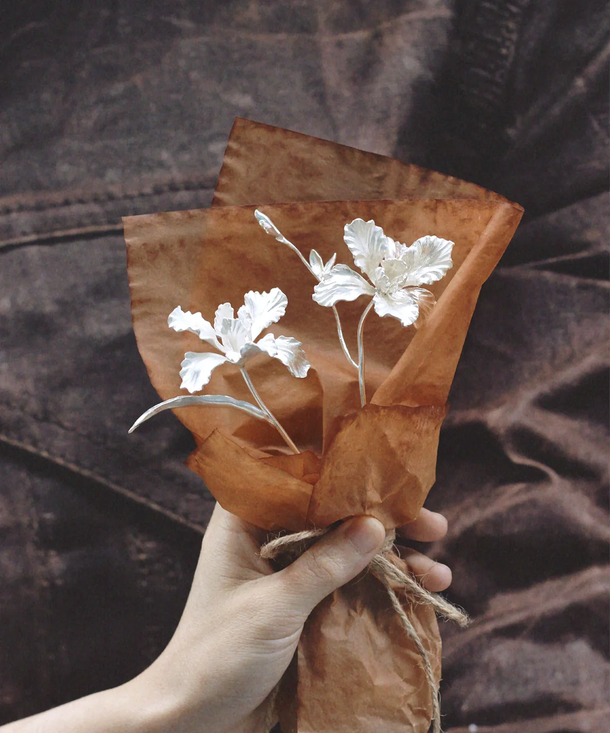 A delicate handmade Iris Bouquet wrapped in rustic brown paper, symbolizing timeless beauty. Perfect as 925 sterling silver Art Gifts from Lazesoul, crafted for meaningful moments and elegant keepsakes.