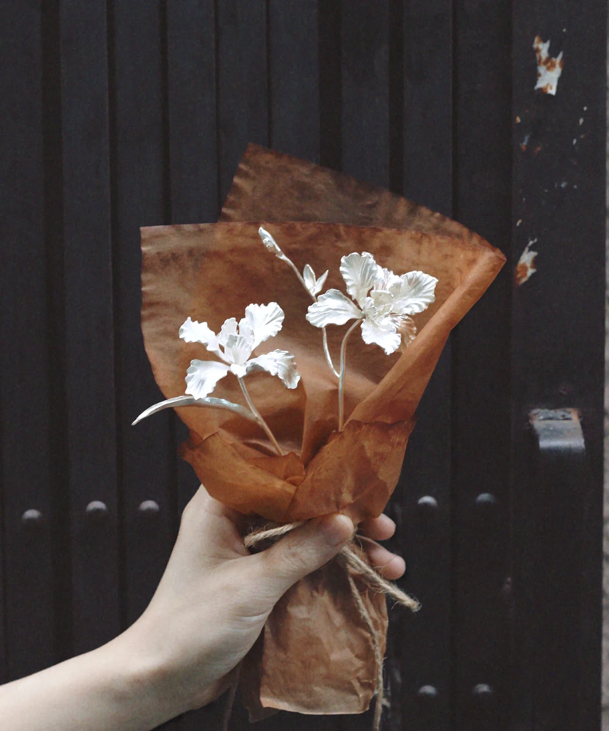 A delicate handmade Iris Bouquet wrapped in rustic brown paper, symbolizing timeless elegance. Perfect as 925 sterling silver inspired Art Gifts by Lazesoul, blending artistry with nature‑inspired charm.