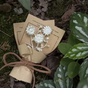 Handmade 925 sterling silver mini daisy bouquet earrings by Lazesoul, styled as artisanal art gifts. Delicate floral design on rustic brown card, wrapped with twine, photographed on forest floor for a nature‑inspired aesthetic.