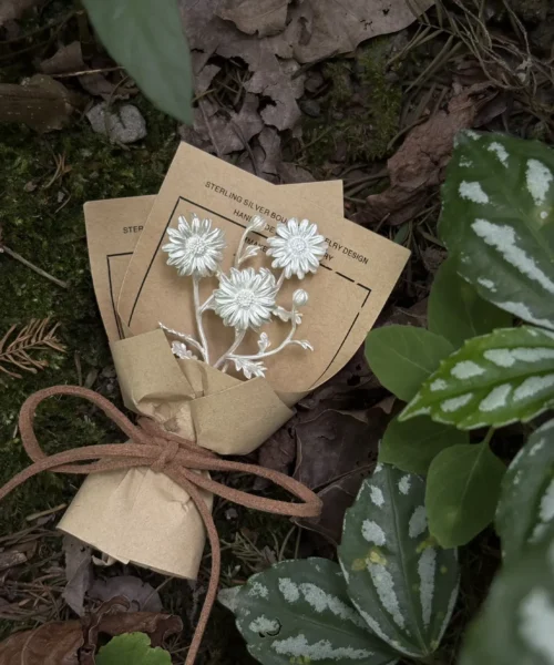 Handmade 925 sterling silver mini daisy bouquet earrings by Lazesoul, styled as artisanal art gifts. Delicate floral design on rustic brown card, wrapped with twine, photographed on forest floor for a nature‑inspired aesthetic.