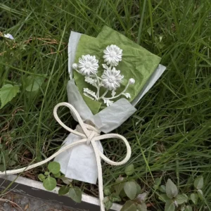 Elegant 925 sterling silver mini daisy bouquet wrapped in white and green paper with ribbon, handmade by Lazesoul. Perfect nature-inspired art gifts for collectors and special occasions.
