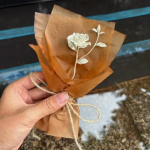 A delicate 925 sterling silver mini Gardenia Bouquet wrapped in rustic brown paper, handmade by Lazesoul. Elegant Art Gifts inspired by nature, perfect for timeless keepsakes and meaningful celebrations.