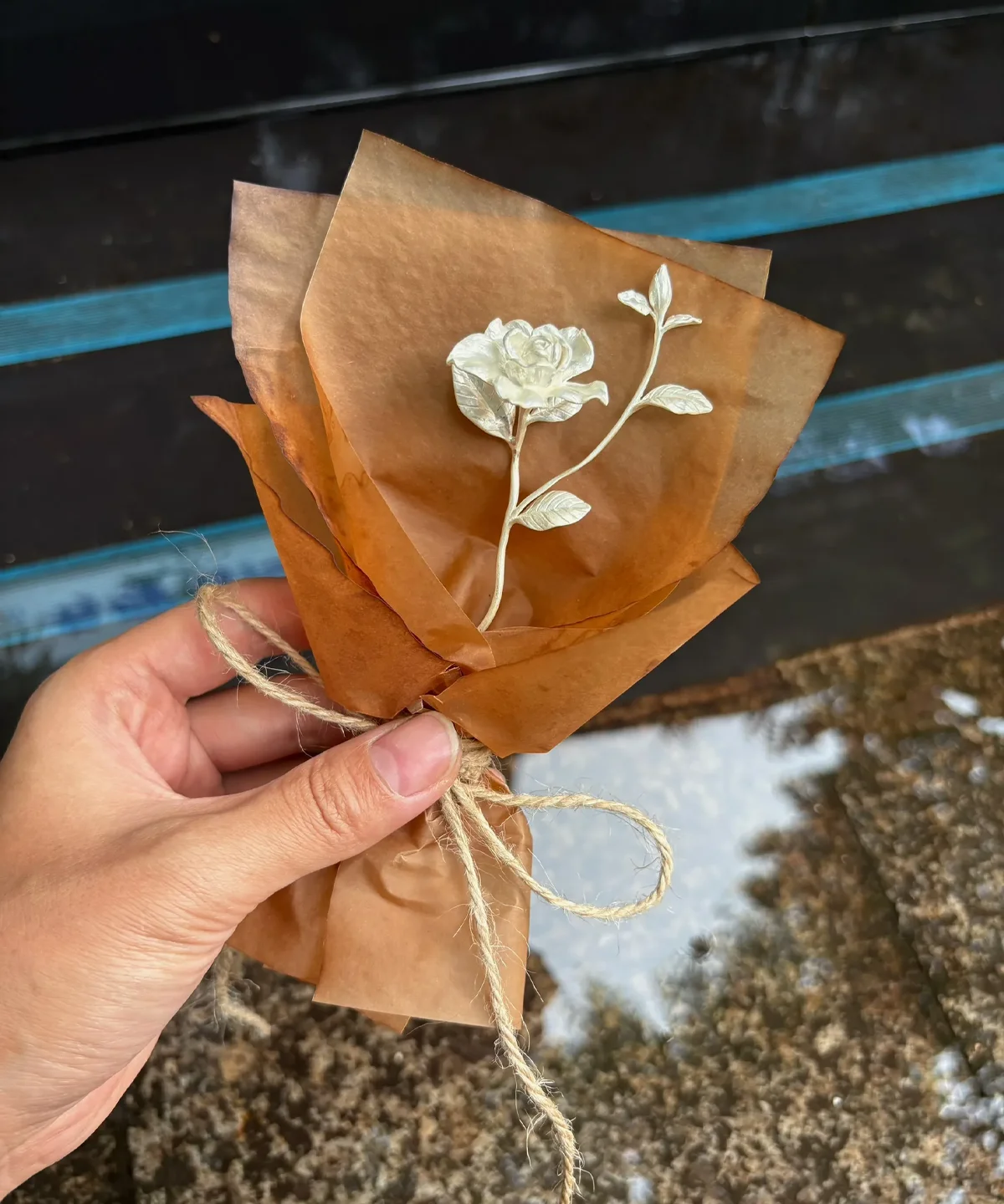 A delicate 925 sterling silver mini Gardenia Bouquet wrapped in rustic brown paper, handmade by Lazesoul. Elegant Art Gifts inspired by nature, perfect for timeless keepsakes and meaningful celebrations.